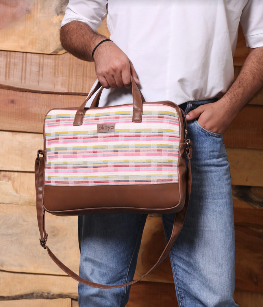 COTTAGE STRIPES MESSENGER BAG/ laptop bag, leather on sides, bottom and handles, man holding close-up